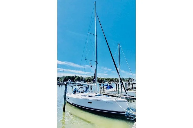 Slide: The Image of Sailboat docked at marina, 2002 Hunter 356 model under clear blue sky. - 9