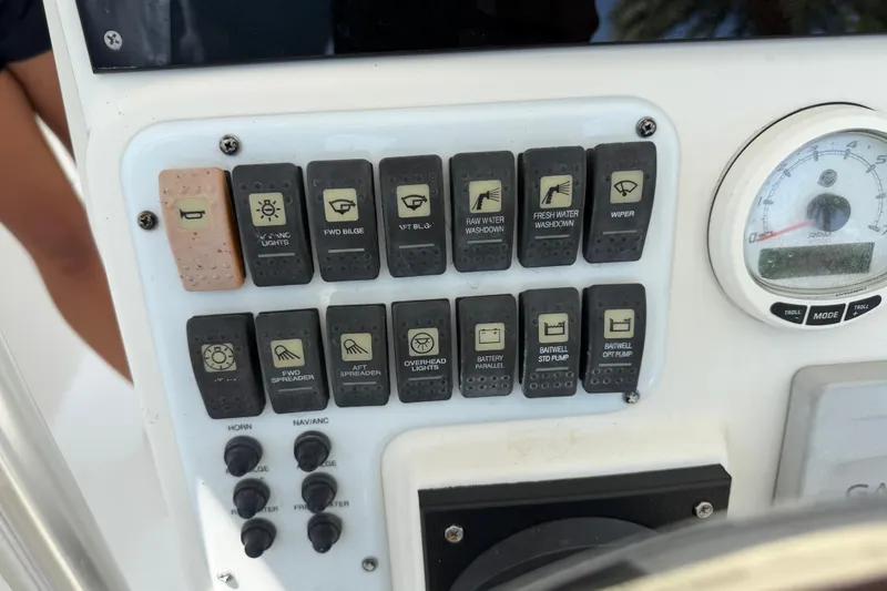 Slide: The Image of Control panel of a 2008 Hydra-Sports Vector 2900 CC boat with various switches and a gauge. - 19