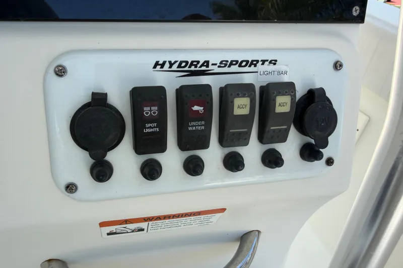 Slide: The Image of Control panel of a 2008 Hydra-Sports Vector 2900 CC boat with various switches. - 20