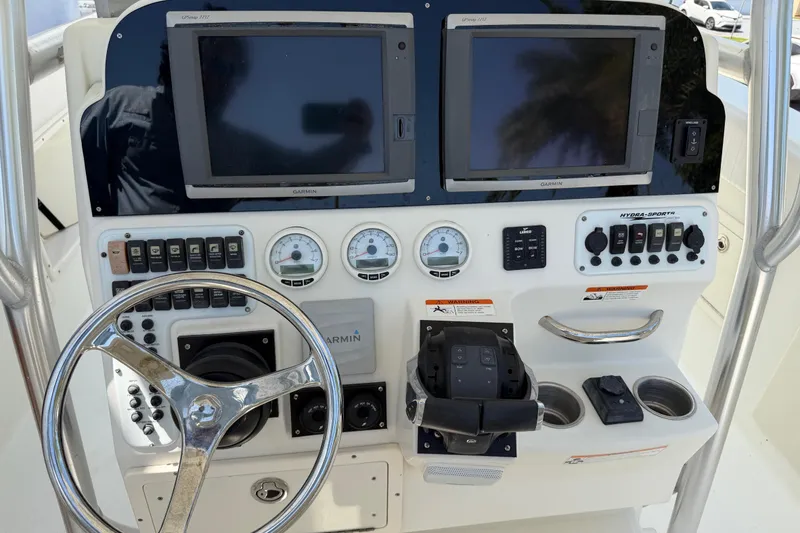 Slide: The Image of 2008 Hydra-Sports Vector 2900 CC dashboard with Garmin displays and control panel. - 23