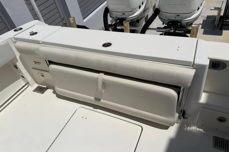 Slide: The Image of 2008 Hydra-Sports Vector 2900 CC boat interior with foldable seating and dual outboard engines. - 25