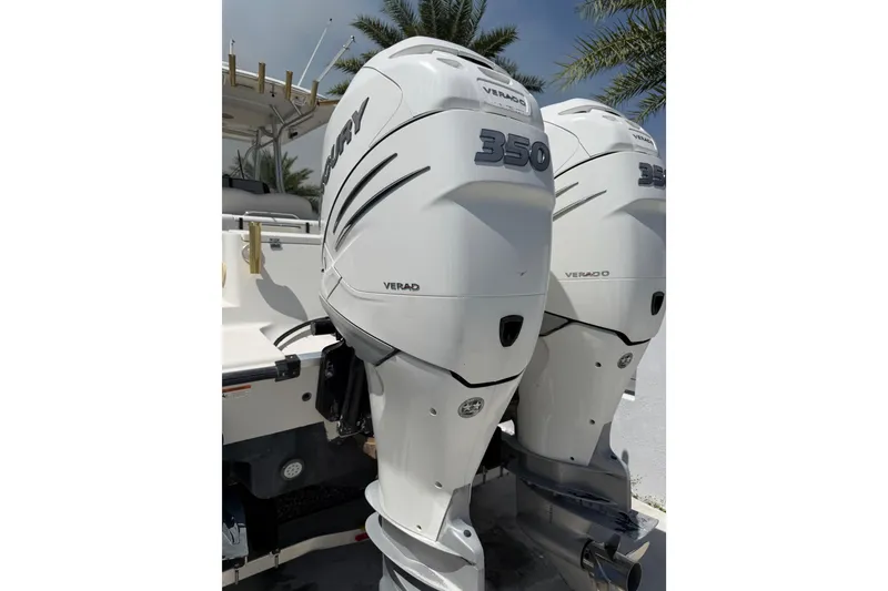 Slide: The Image of 2008 Hydra-Sports Vector 2900 CC with twin Mercury Verado 350 engines, docked under palm trees. - 32