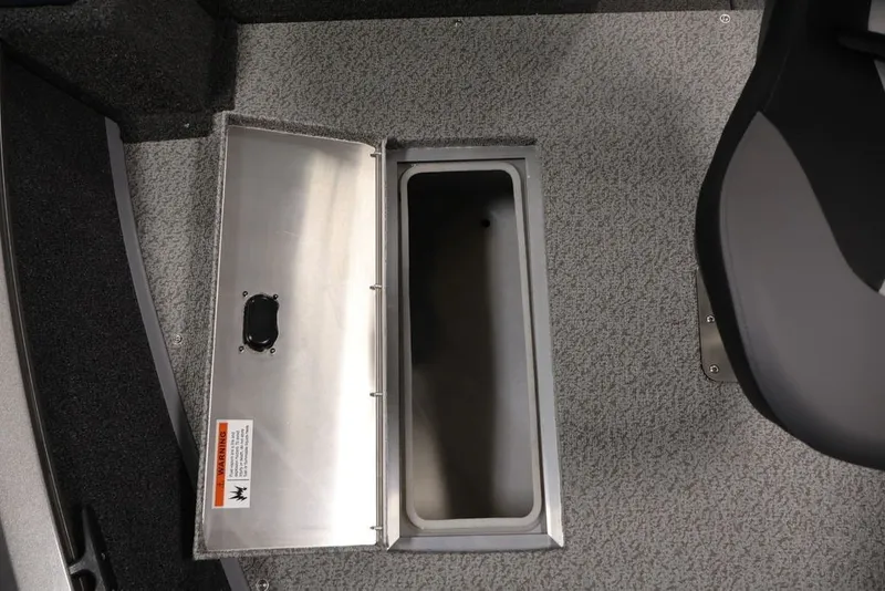 Slide: The Image of 2027 Lowe Fishing Machine 1675WT interior storage compartment with open lid. - 28