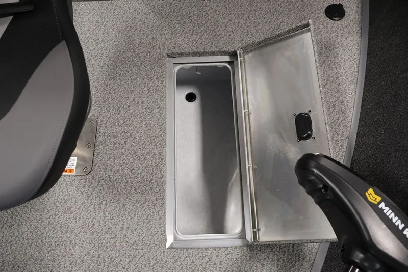 Slide: The Image of 2027 Lowe Fishing Machine 1675WT interior with storage compartment and Minn Kota trolling motor. - 26
