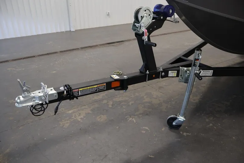 Slide: The Image of Trailer hitch of 2027 Lowe Fishing Machine 1675WT in a garage setting. - 61
