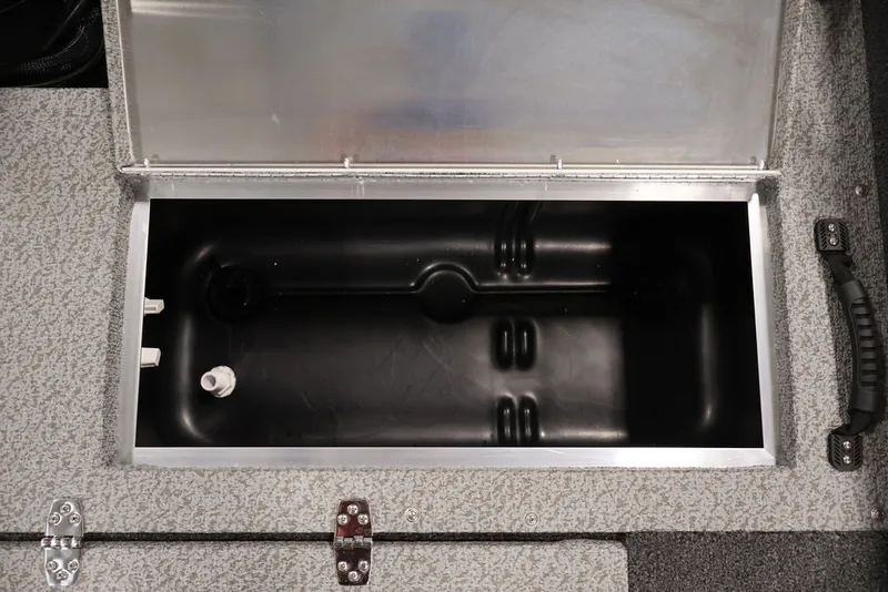 Slide: The Image of Open storage compartment in a 2027 Lowe Fishing Machine 1675WT boat. - 57