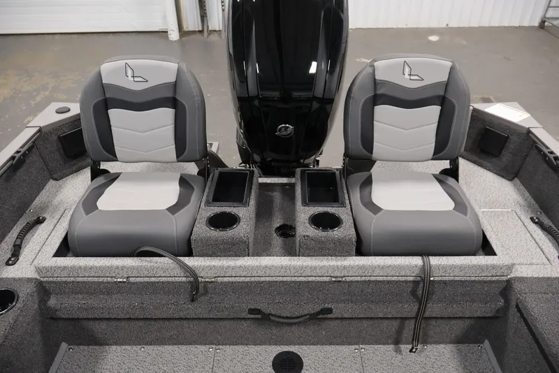 Slide: The Image of 2027 Lowe Fishing Machine 1675WT interior with dual seats and storage compartments. - 44
