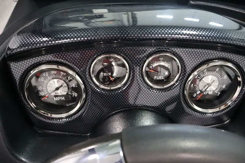 Slide: The Image of Dashboard of 2027 Lowe Fishing Machine 1675WT with speedometer, trim, fuel, and RPM gauges. - 33