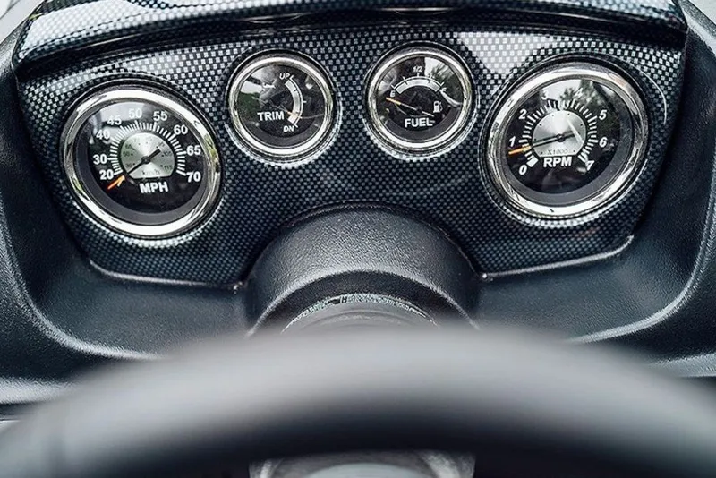Slide: The Image of Dashboard of 2027 Lowe Fishing Machine 1675WT with speedometer, trim, fuel, and RPM gauges. - 54