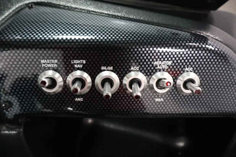 Slide: The Image of Control panel of 2027 Lowe Fishing Machine 1675WT with switches for power and accessories. - 37