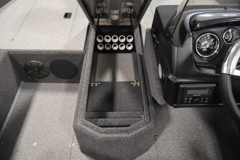 Slide: The Image of 2027 Lowe Fishing Machine 1775SC interior with rod storage and dashboard controls. - 18