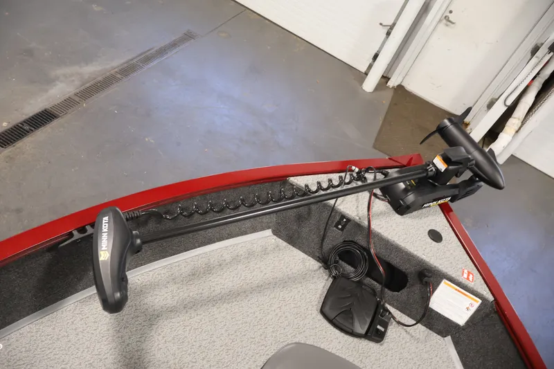 Slide: The Image of 2027 Lowe Fishing Machine 1775SC with Minn Kota trolling motor in a garage setting. - 8