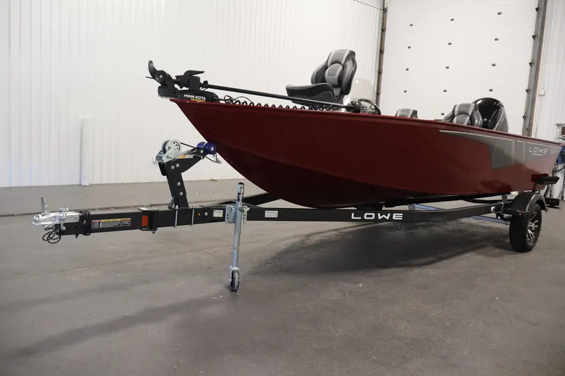 Slide: The Image of 2027 Lowe Fishing Machine 1775SC boat on trailer in indoor setting. - 39