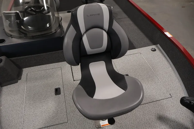Slide: The Image of 2027 Lowe Fishing Machine 1775SC boat seat, gray and black design, cockpit view. - 12