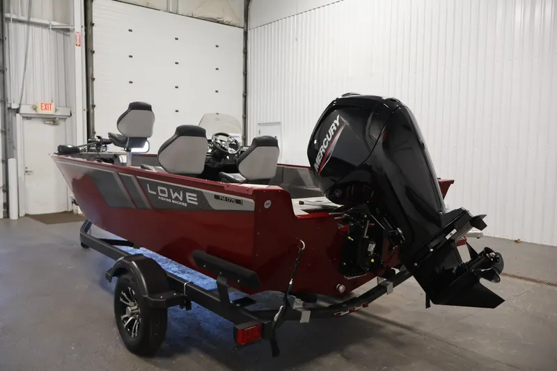 Slide: The Image of 2027 Lowe Fishing Machine 1775SC boat with Mercury engine in a garage setting. - 6