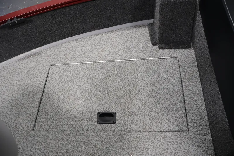 Slide: The Image of Carpeted storage compartment on 2027 Lowe Fishing Machine 1775SC boat interior. - 15