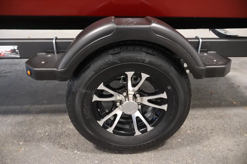 Slide: The Image of Trailer wheel of 2027 Lowe Fishing Machine 1775SC with black fender and alloy rim. - 40