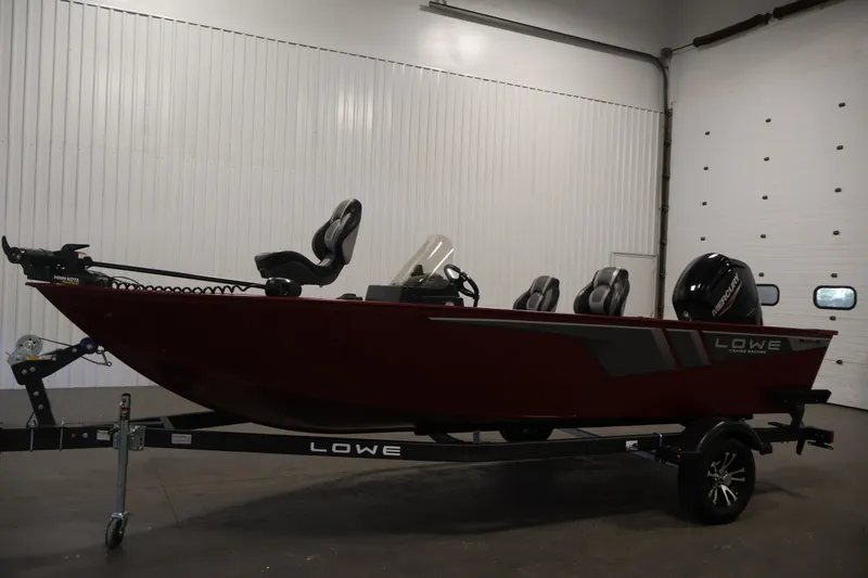 Slide: The Image of 2027 Lowe Fishing Machine 1775SC boat in a showroom, side view. - 7