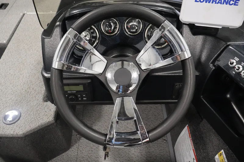 Slide: The Image of Steering wheel and dashboard of 2027 Lowe Fishing Machine 1775SC boat. - 21