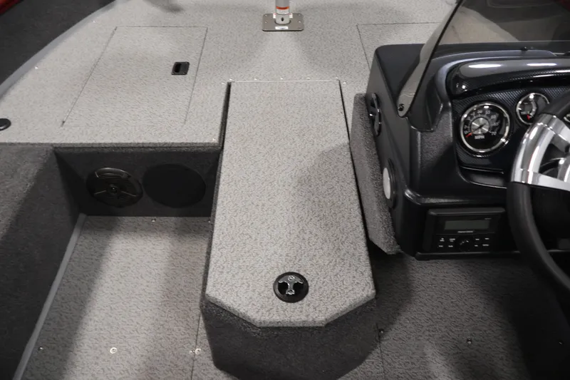 Slide: The Image of 2027 Lowe Fishing Machine 1775SC interior with steering console and storage compartments. - 17