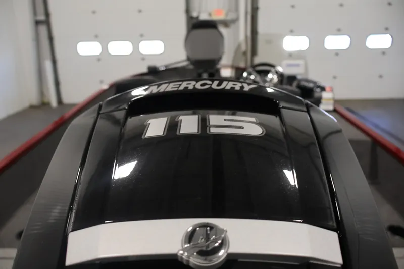 Slide: The Image of 2027 Lowe Fishing Machine 1775SC with Mercury 115 engine in a garage setting. - 36
