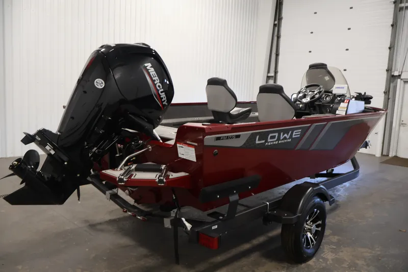 Slide: The Image of 2027 Lowe Fishing Machine 1775SC boat with Mercury engine in a garage setting. - 4