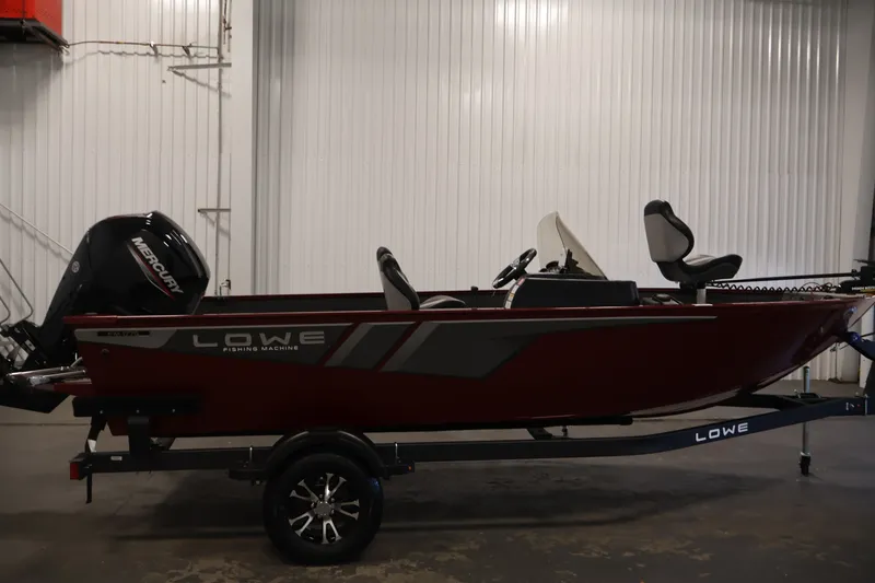 Slide: The Image of 2027 Lowe Fishing Machine 1775SC boat in a showroom, side view. - 3