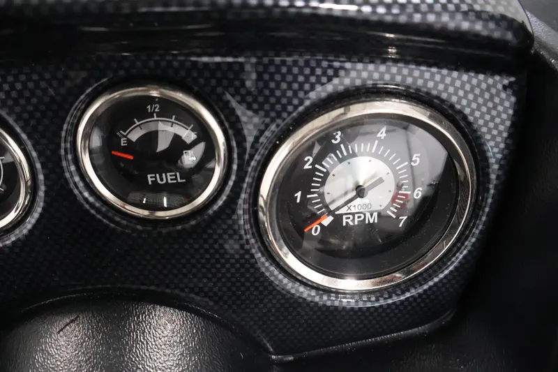 Slide: The Image of Dashboard of 2027 Lowe Fishing Machine 1775SC showing fuel and RPM gauges. - 23
