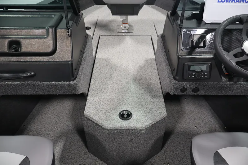 Slide: The Image of Interior view of 2027 Lowe Fishing Machine 1875 boat, featuring steering console and seating. - 14