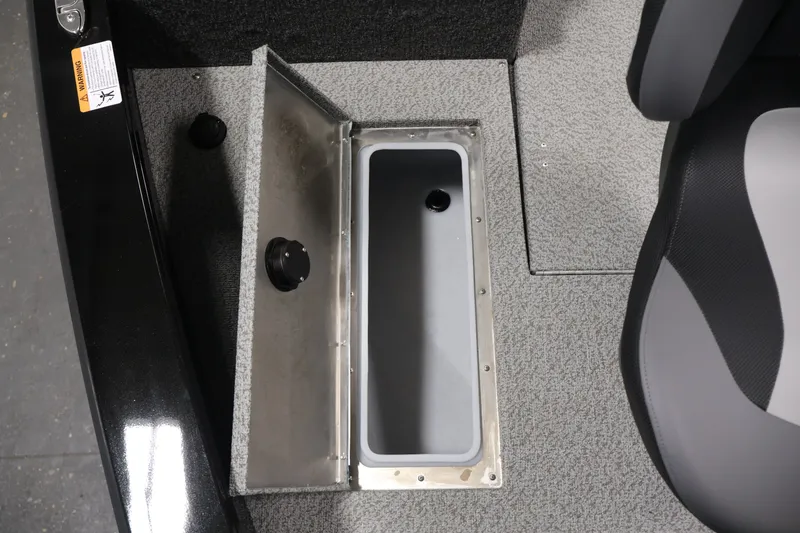 Slide: The Image of 2027 Lowe Fishing Machine 1875 boat interior storage compartment with open lid. - 12