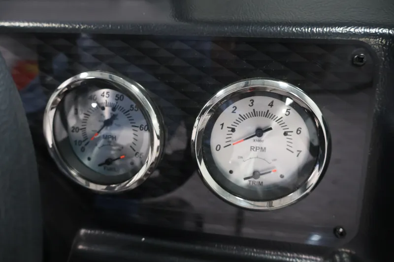 Slide: The Image of Dashboard gauges of 2027 Lowe Fishing Machine 1875, displaying speed and RPM. - 23