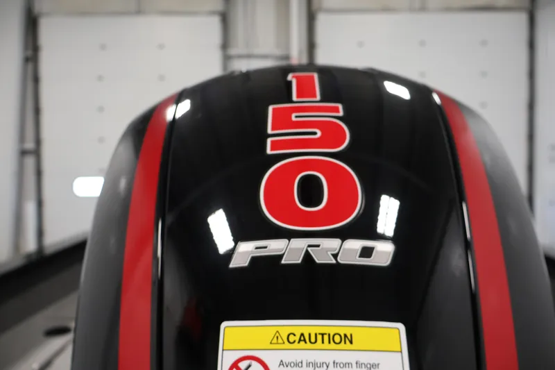 Slide: The Image of Close-up of a 2027 Lowe Fishing Machine 1875 outboard motor with "150 PRO" label. - 39