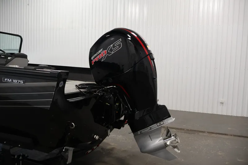 Slide: The Image of 2027 Lowe Fishing Machine 1875 with Mercury Pro XS outboard motor in a showroom. - 37
