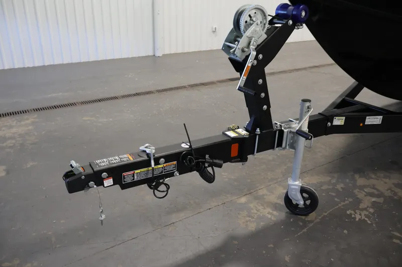 Slide: The Image of Trailer hitch of 2027 Lowe Fishing Machine 1875 in a garage setting. - 41