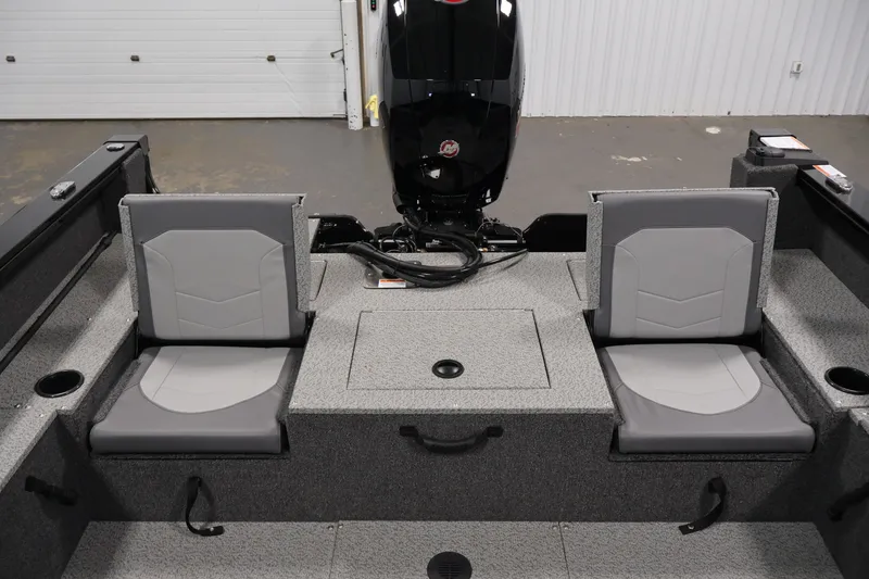 Slide: The Image of 2027 Lowe Fishing Machine 1875 interior with dual gray seats and motor. - 30