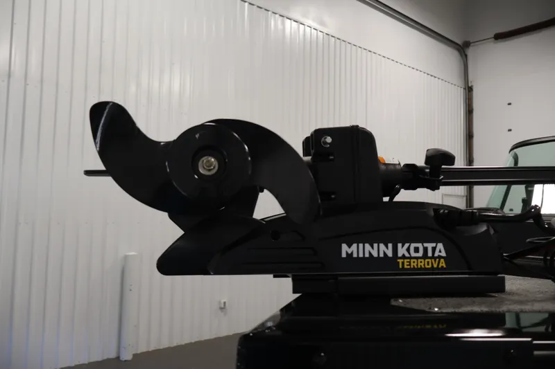 Slide: The Image of Minn Kota Terrova motor on 2027 Lowe Fishing Machine 1875 boat in a garage. - 8