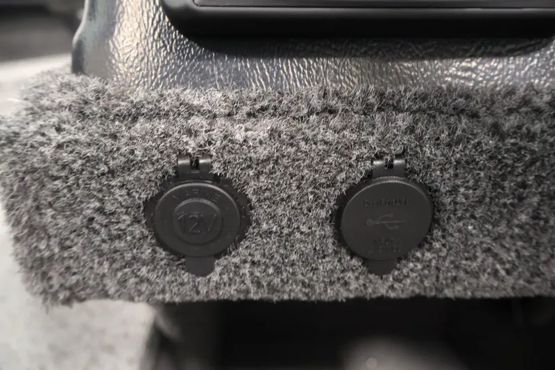Slide: The Image of 12V and USB ports on 2027 Lowe Fishing Machine 1875 boat interior. - 25