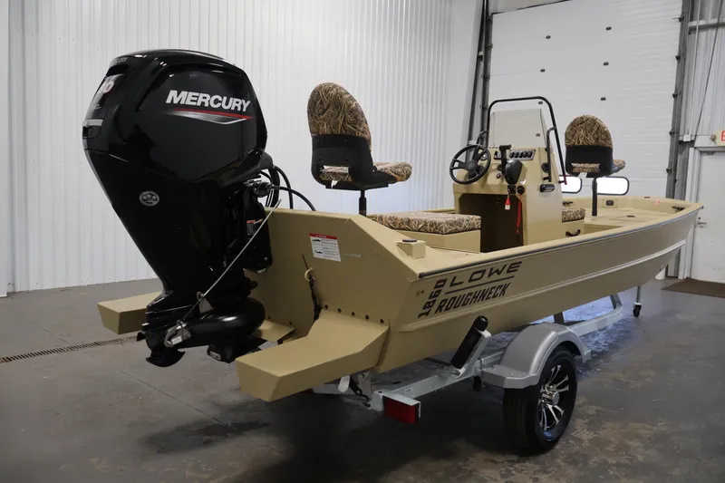 Slide: The Image of 2027 Lowe Roughneck RX1860 Tunnel Jet boat with Mercury engine in a garage setting. - 4