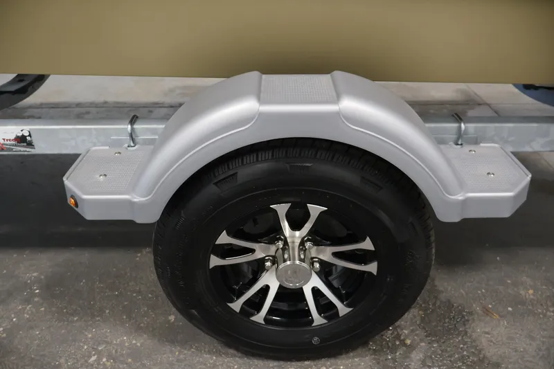 Slide: The Image of Trailer wheel and fender of 2027 Lowe Roughneck RX1860 Tunnel Jet boat. - 32
