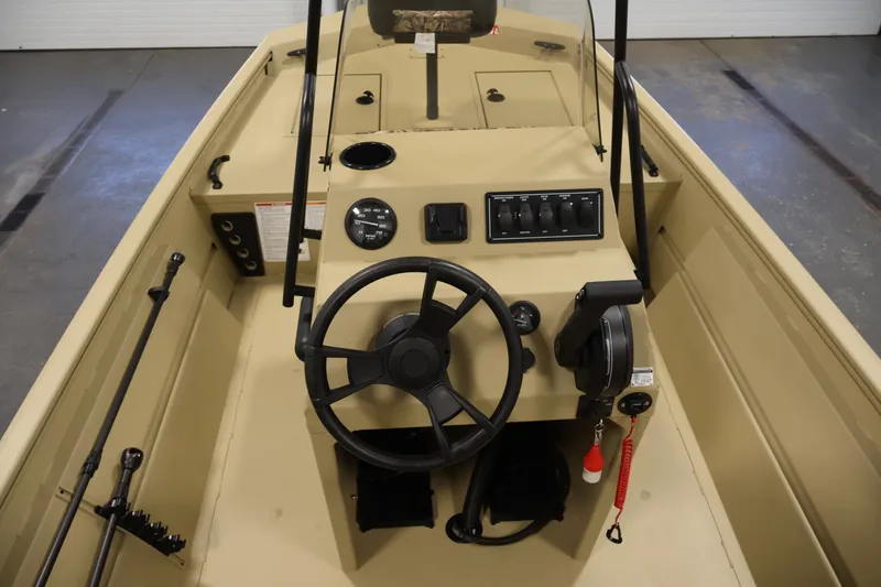 Slide: The Image of 2027 Lowe Roughneck RX1860 Tunnel Jet boat interior with steering wheel and control panel. - 17