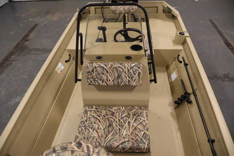 Slide: The Image of 2027 Lowe Roughneck RX1860 Tunnel Jet boat interior with camouflage seating and steering console. - 14