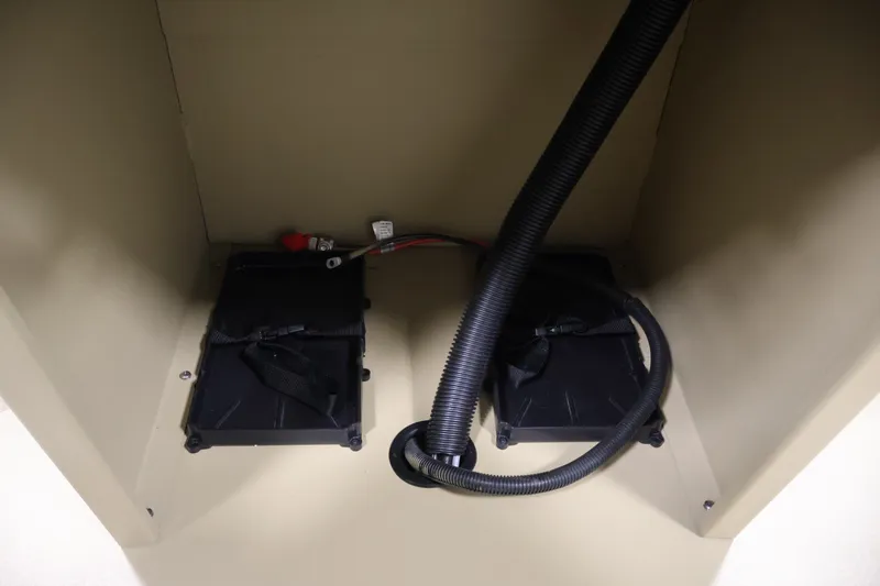 Slide: The Image of Battery compartment of 2027 Lowe Roughneck RX1860 Tunnel Jet boat, featuring secure wiring. - 22