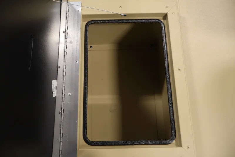 Slide: The Image of Open storage compartment on 2027 Lowe Roughneck RX1860 Tunnel Jet boat. - 24