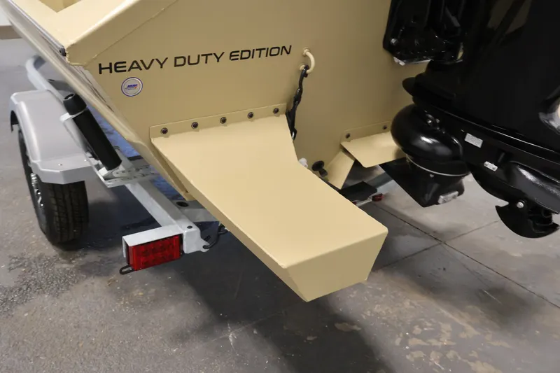 Slide: The Image of 2027 Lowe Roughneck RX1860 Tunnel Jet boat, heavy-duty edition, rear view with trailer. - 27