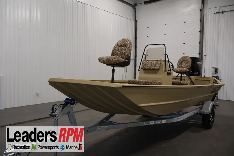 The Image of 2027 Lowe Roughneck RX1860 Tunnel Jet boat on trailer in indoor showroom. - 0