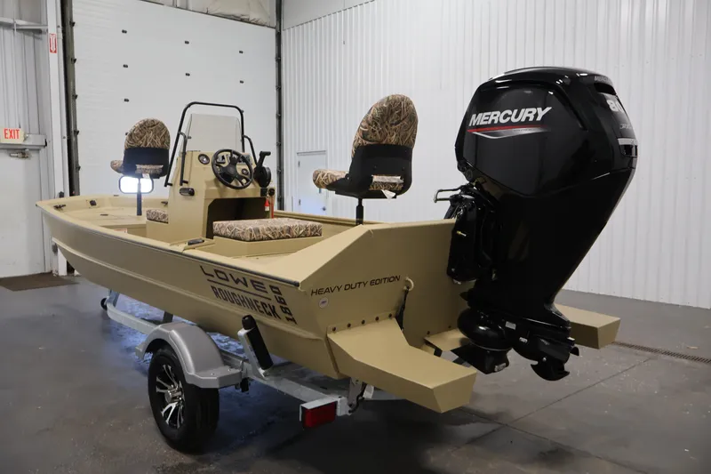 Slide: The Image of 2027 Lowe Roughneck RX1860 Tunnel Jet boat with Mercury engine in a garage setting. - 6
