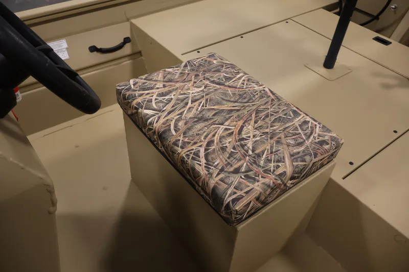 Slide: The Image of Interior of 2027 Lowe Roughneck RX1860 Tunnel Jet with camo-patterned seat cushion. - 23