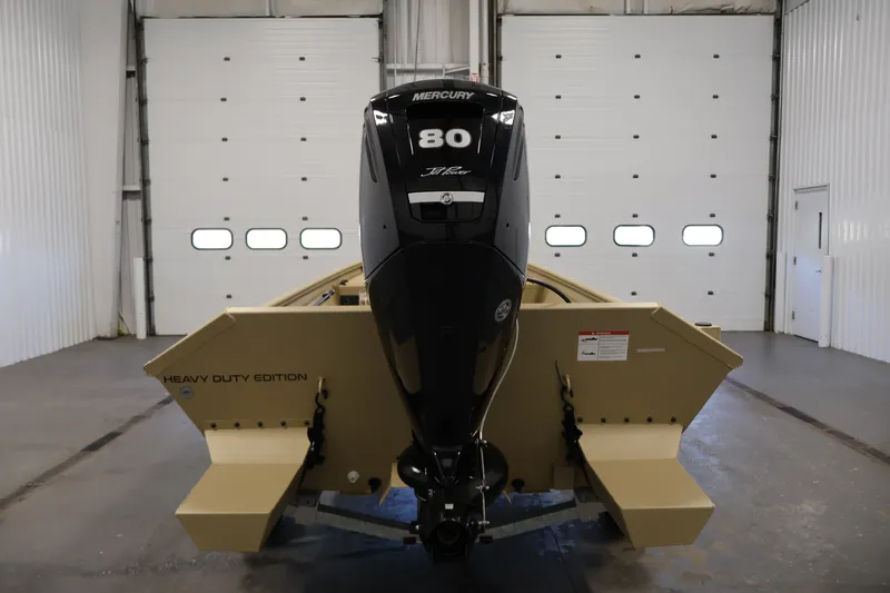 Slide: The Image of 2027 Lowe Roughneck RX1860 Tunnel Jet boat with Mercury 80 engine in a garage. - 5