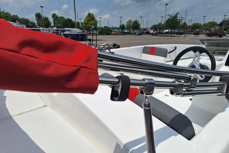 Slide: The Image of 2026 Tahoe T18 boat interior with red accents and steering wheel in parking lot. - 5