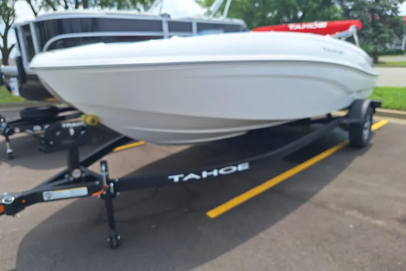 The Image of 2026 Tahoe T18 boat on trailer in parking lot. - 0